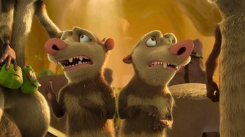 Movie still from “The Ice Age Adventures of Buck Wild” (2022), directed by John C. Donkin – A couple of animals standing next to each other on top of a field; Medium shot, Low angle