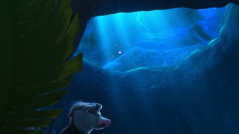 Movie still from “The Ice Age Adventures of Buck Wild” (2022), directed by John C. Donkin – A sheep's face in a cave; Wide shot, Low angle