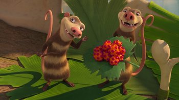 Movie still from “The Ice Age Adventures of Buck Wild” (2022), directed by John C. Donkin – A couple of animals standing next to each other on a plant; Wide shot, Low angle