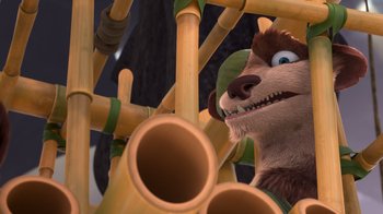 Movie still from “The Ice Age Adventures of Buck Wild” (2022), directed by John C. Donkin – A brown and white bear is looking at a bunch of pipes; Close Up shot, Low angle
