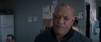 Movie still from “The Ice Road” (2021), directed by Jonathan Hensleigh – An older man is looking at the camera; Close Up shot, Over the shoulder angle