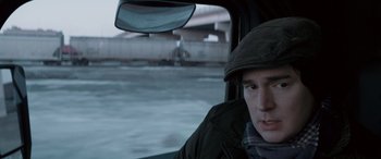 Movie still from “The Ice Road” (2021), directed by Jonathan Hensleigh – A man in a car looking out of the window; Close Up shot, Over the shoulder angle
