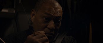 Movie still from “The Ice Road” (2021), directed by Jonathan Hensleigh – An older man is looking at the camera; Close Up shot, Low angle