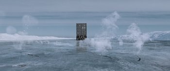 Movie still from “The Ice Road” (2021), directed by Jonathan Hensleigh – A container ship in the middle of the ocean; Extreme Wide shot, Low angle