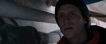 Movie still from “The Ice Road” (2021), directed by Jonathan Hensleigh – A person wearing a hat; Close Up shot, Low angle
