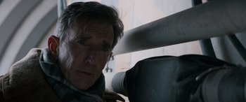 Movie still from “The Ice Road” (2021), directed by Jonathan Hensleigh – A person leaning on a railing; Close Up shot, Low angle