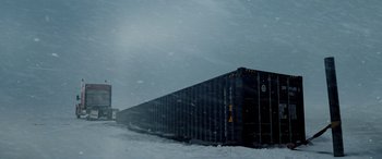Movie still from “The Ice Road” (2021), directed by Jonathan Hensleigh – A long train on a track in the snow; Extreme Wide shot, Low angle