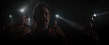 Movie still from “The Ice Road” (2021), directed by Jonathan Hensleigh – A man with a headlamp on his head; Close Up shot, Low angle