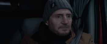Movie still from “The Ice Road” (2021), directed by Jonathan Hensleigh – A person wearing a hat; Close Up shot, Over the shoulder angle