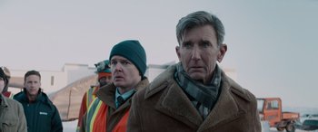 Movie still from “The Ice Road” (2021), directed by Jonathan Hensleigh – A group of men standing next to each other; Close Up shot, Over the shoulder angle