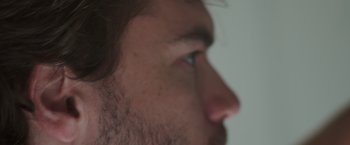 Movie still from “The Immaculate Room” (2022), directed by Mukunda Michael Dewil – A man's eye and nose; Extreme Close Up shot, Low angle