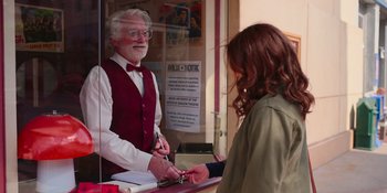 Movie still from “The In Between” (2022), directed by Arie Posin – A man standing in front of a woman in front of a window; Medium shot, Over the shoulder angle