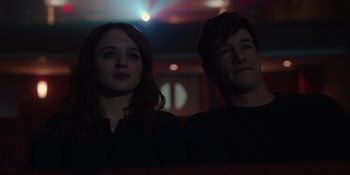 Movie still from “The In Between” (2022), directed by Arie Posin – A man and a woman sitting next to each other in front of lights; Close Up shot, Over the shoulder angle