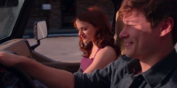 Movie still from “The In Between” (2022), directed by Arie Posin – A young man and a young woman sitting in a car; Medium shot, Over the shoulder angle