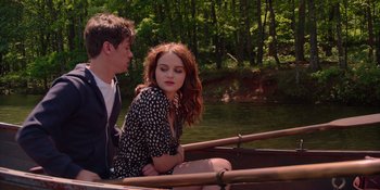 Movie still from “The In Between” (2022), directed by Arie Posin – A man and a woman sitting in a boat on a river; Medium shot, Over the shoulder angle