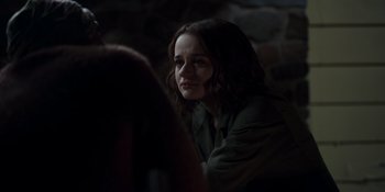 Movie still from “The In Between” (2022), directed by Arie Posin – A woman sitting in front of a mirror in the dark; Close Up shot, Over the shoulder angle