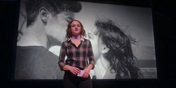 Movie still from “The In Between” (2022), directed by Arie Posin – A woman standing in front of a picture of a woman; Medium shot, Over the shoulder angle