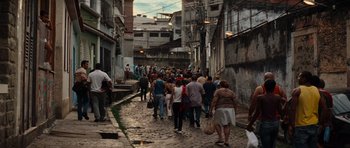 Movie still from “The Incredible Hulk” (2008), directed by Louis Leterrier – A group of people walking down a narrow street; Extreme Wide shot, High angle
