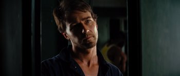 Movie still from “The Incredible Hulk” (2008), directed by Louis Leterrier – A person wearing a blue shirt; Close Up shot, Over the shoulder angle