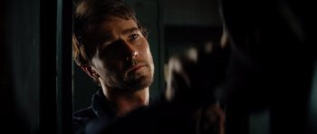 Movie still from “The Incredible Hulk” (2008), directed by Louis Leterrier – A man's face in a dark room; Close Up shot, Low angle