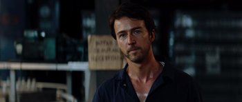 Movie still from “The Incredible Hulk” (2008), directed by Louis Leterrier – A person wearing a black shirt; Close Up shot, Over the shoulder angle