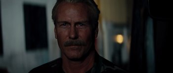 Movie still from “The Incredible Hulk” (2008), directed by Louis Leterrier – A person with a mustache; Close Up shot, Low angle