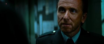 Movie still from “The Incredible Hulk” (2008), directed by Louis Leterrier – A person wearing a military uniform; Close Up shot, Over the shoulder angle