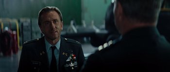Movie still from “The Incredible Hulk” (2008), directed by Louis Leterrier – A man in a military uniform talking to another man; Close Up shot, Over the shoulder angle