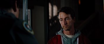 Movie still from “The Incredible Hulk” (2008), directed by Louis Leterrier – A person wearing a red jacket; Close Up shot, Over the shoulder angle