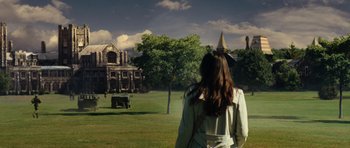 Movie still from “The Incredible Hulk” (2008), directed by Louis Leterrier – A woman standing in front of an old house; Extreme Wide shot, Over the shoulder angle
