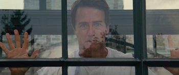 Movie still from “The Incredible Hulk” (2008), directed by Louis Leterrier – A person looking through a window; Close Up shot, Low angle