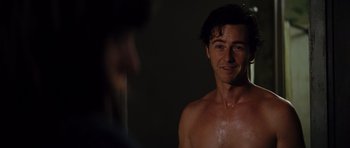 Movie still from “The Incredible Hulk” (2008), directed by Louis Leterrier – A shirtless man in the dark looking into a mirror; Close Up shot, Over the shoulder angle