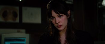 Movie still from “The Incredible Hulk” (2008), directed by Louis Leterrier – A beautiful young woman with long dark hair; Close Up shot, Over the shoulder angle