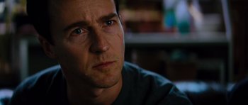 Movie still from “The Incredible Hulk” (2008), directed by Louis Leterrier – A man's face in a dark room; Close Up shot, Over the shoulder angle