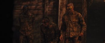 Movie still from “The Inspection” (2022), directed by Elegance Bratton – A group of men in camouflage uniforms standing next to each other; Medium shot, High angle