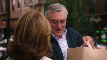 Movie still from “The Intern” (2015), directed by Nancy Meyers – An older man and a younger woman looking at each other; Close Up shot, Over the shoulder angle