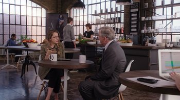 Movie still from “The Intern” (2015), directed by Nancy Meyers – Two people are sitting at a table in a restaurant; Wide shot, Over the shoulder angle