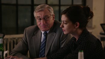 Movie still from “The Intern” (2015), directed by Nancy Meyers – A man and a woman sitting in front of a computer screen; Close Up shot, Over the shoulder angle