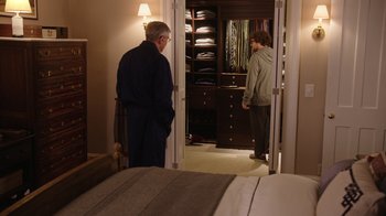 Movie still from “The Intern” (2015), directed by Nancy Meyers – Two people in a room looking at each other in a closet; Wide shot, Over the shoulder angle
