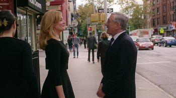Movie still from “The Intern” (2015), directed by Nancy Meyers – A man and a woman talking on the sidewalk; Medium shot, Over the shoulder angle