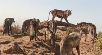 Movie still from “The Jungle Book” (2016), directed by Jon Favreau – A herd of wild animals standing on top of a hill; Extreme Wide shot, High angle