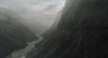 Movie still from “The Jungle Book” (2016), directed by Jon Favreau – A view of a river flowing through a mountain valley; Extreme Wide shot, High angle