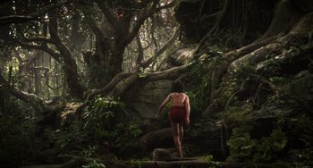 Movie still from “The Jungle Book” (2016), directed by Jon Favreau – A woman in a bathing suit walking through the woods; Extreme Wide shot, Low angle