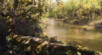 Movie still from “The Jungle Book” (2016), directed by Jon Favreau – A view of a river with trees in the background; Extreme Wide shot, High angle