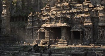 Movie still from “The Jungle Book” (2016), directed by Jon Favreau – An old stone building with many statues on the ground; Extreme Wide shot, Low angle