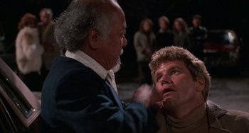 Movie still from “The Karate Kid Part III” (1989), directed by John G. Avildsen – An older man and a younger man are looking at each other; Close Up shot, Over the shoulder angle