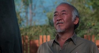 Movie still from “The Karate Kid Part III” (1989), directed by John G. Avildsen – An older man is looking up into the sky; Close Up shot, Low angle
