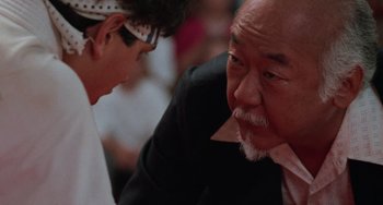Movie still from “The Karate Kid Part III” (1989), directed by John G. Avildsen – A man and a woman talking to each other; Close Up shot, Low angle