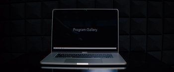 Movie still from “The Kill Room” (2023), directed by Nicol Paone – A laptop computer sitting on top of a table; Extreme Close Up shot, High angle