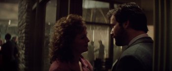 Movie still from “Die Hard” (1988), directed by John McTiernan – A woman and a man are looking at each other; Close Up shot, Over the shoulder angle